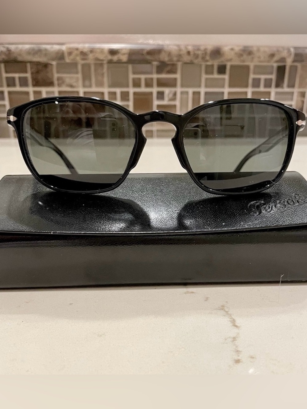 Persol Black Frame Sunglasses with Dark Green Lenses